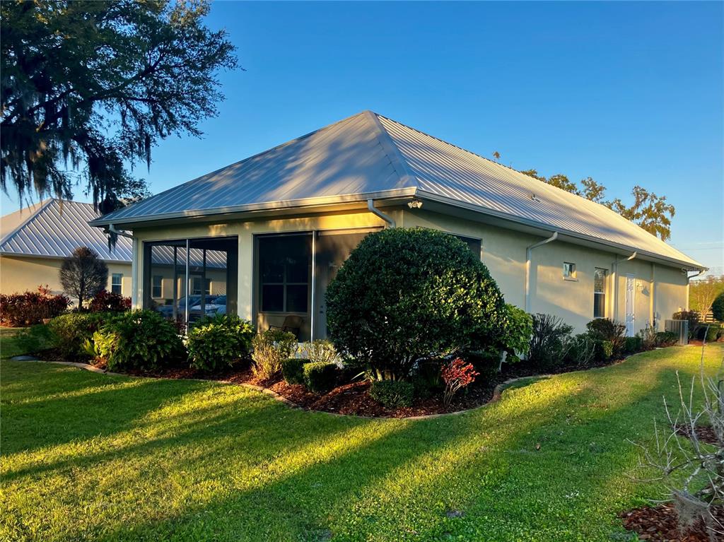 3709 Gallagher Road Plant City, FL 33565 - Photo 46 of 60 a view of a house with backyard sitting area and garden