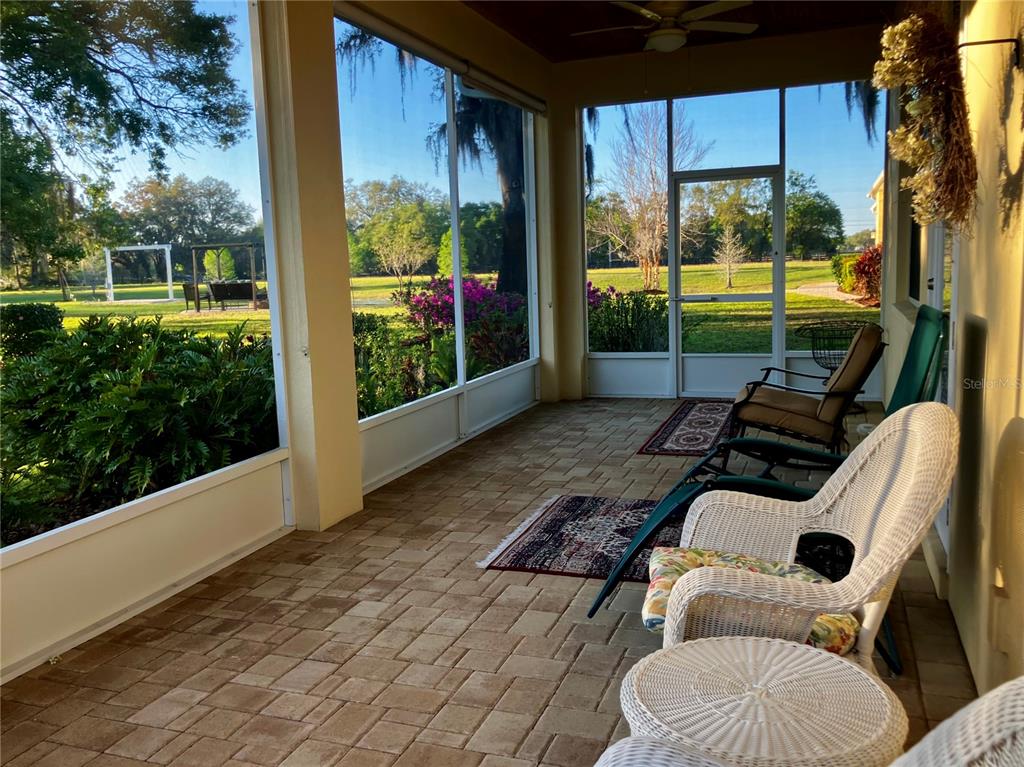 3709 Gallagher Road Plant City, FL 33565 - Photo 54 of 60 a view of a porch with furniture and a yard