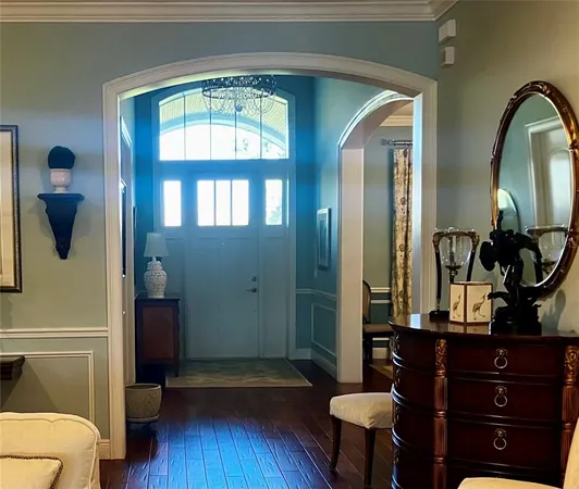 a view of a livingroom with furniture and a floor to ceiling window