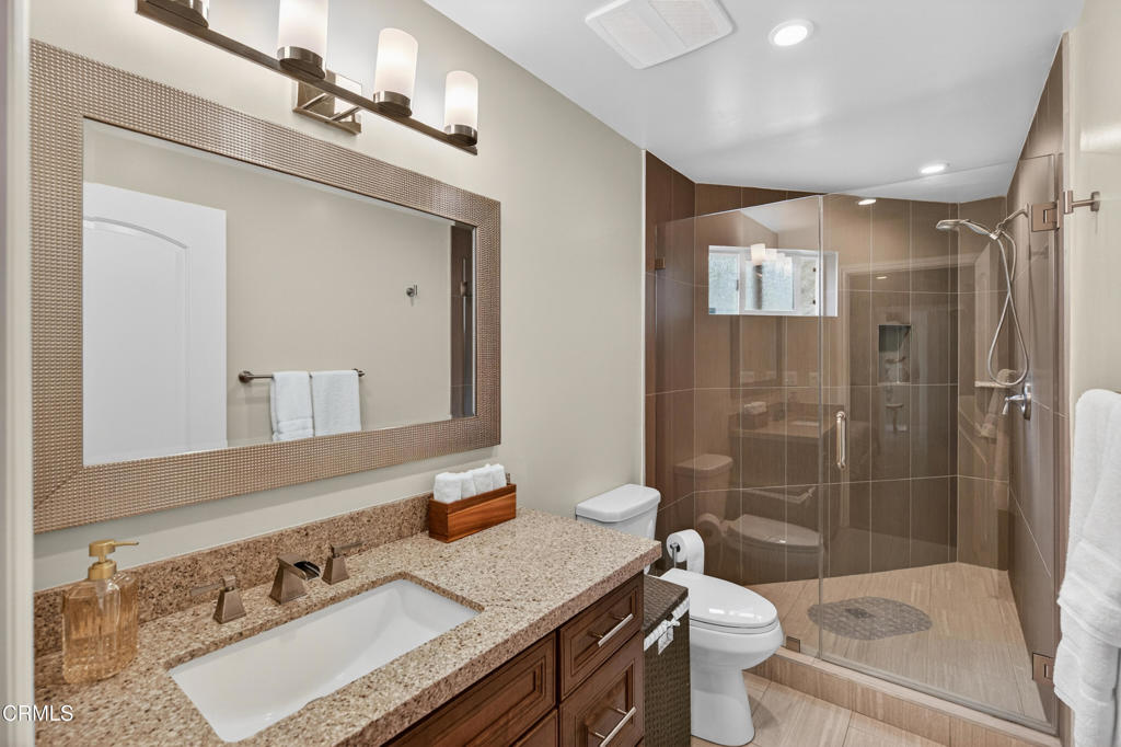 9325 La Shell Drive Tujunga, CA 91042 - Photo 40 of 46 a bathroom with a sink a toilet and shower