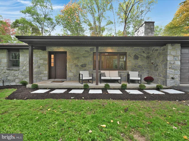 a backyard of a house with seating space