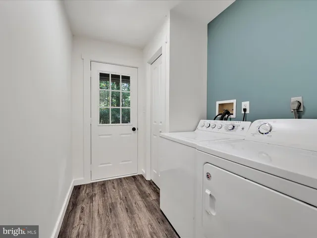 a room with a sink and a mirror