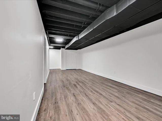 a view of hallway with wooden floor