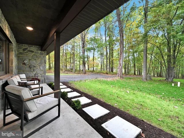 a building view with a sitting space and garden