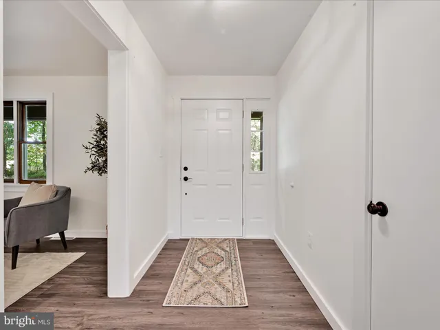 a view of room with wooden floor and chair