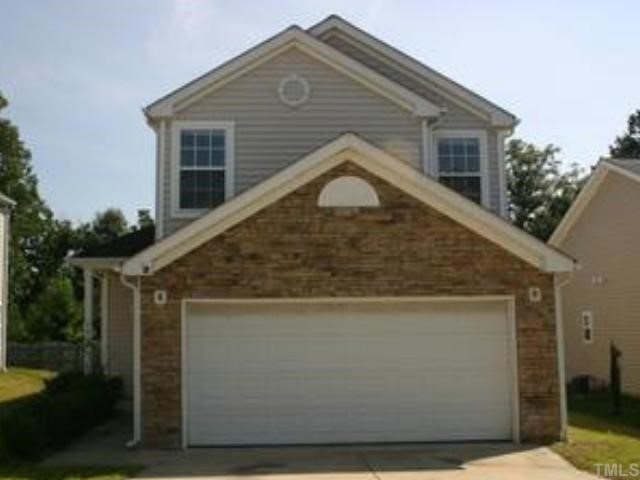 4816 Tommans Trail Raleigh, NC 27616 - Photo 1 of 1 a front view of a house with a yard