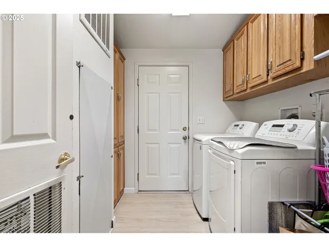 a utility room with closet dryer and washer