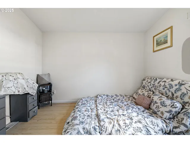 a bedroom with a bed and chair