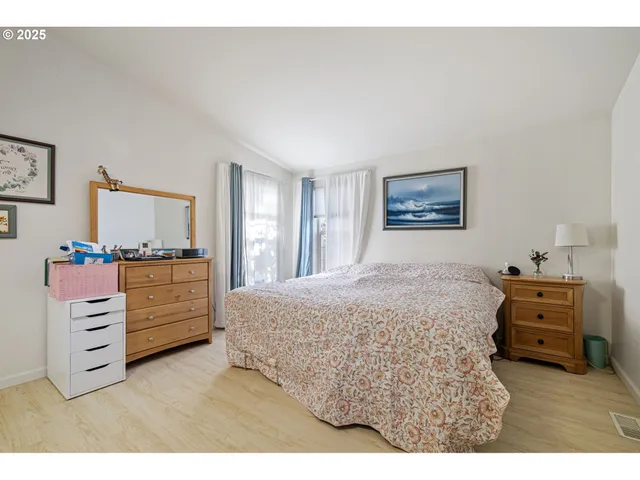 a bedroom with a bed and furniture