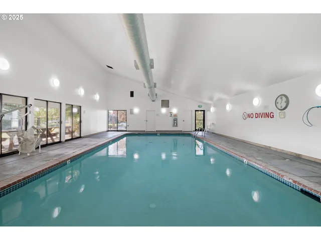 a swimming pool with a outdoor seating