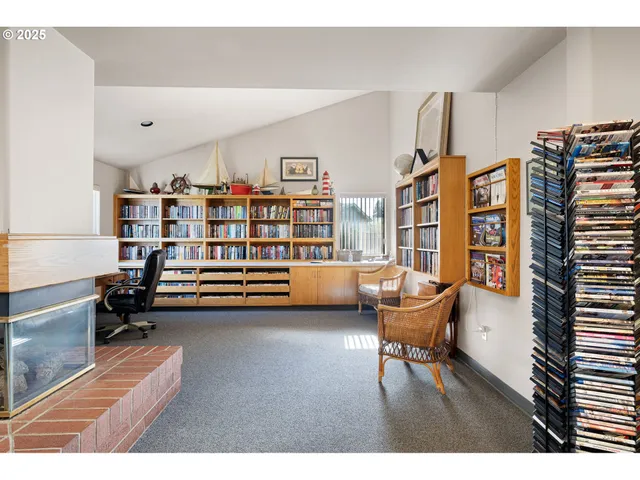 a bedroom with furniture and a book shelf