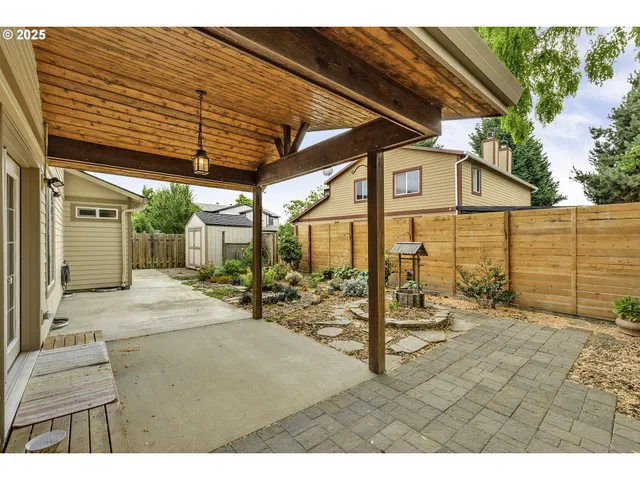 a view of a backyard with a patio