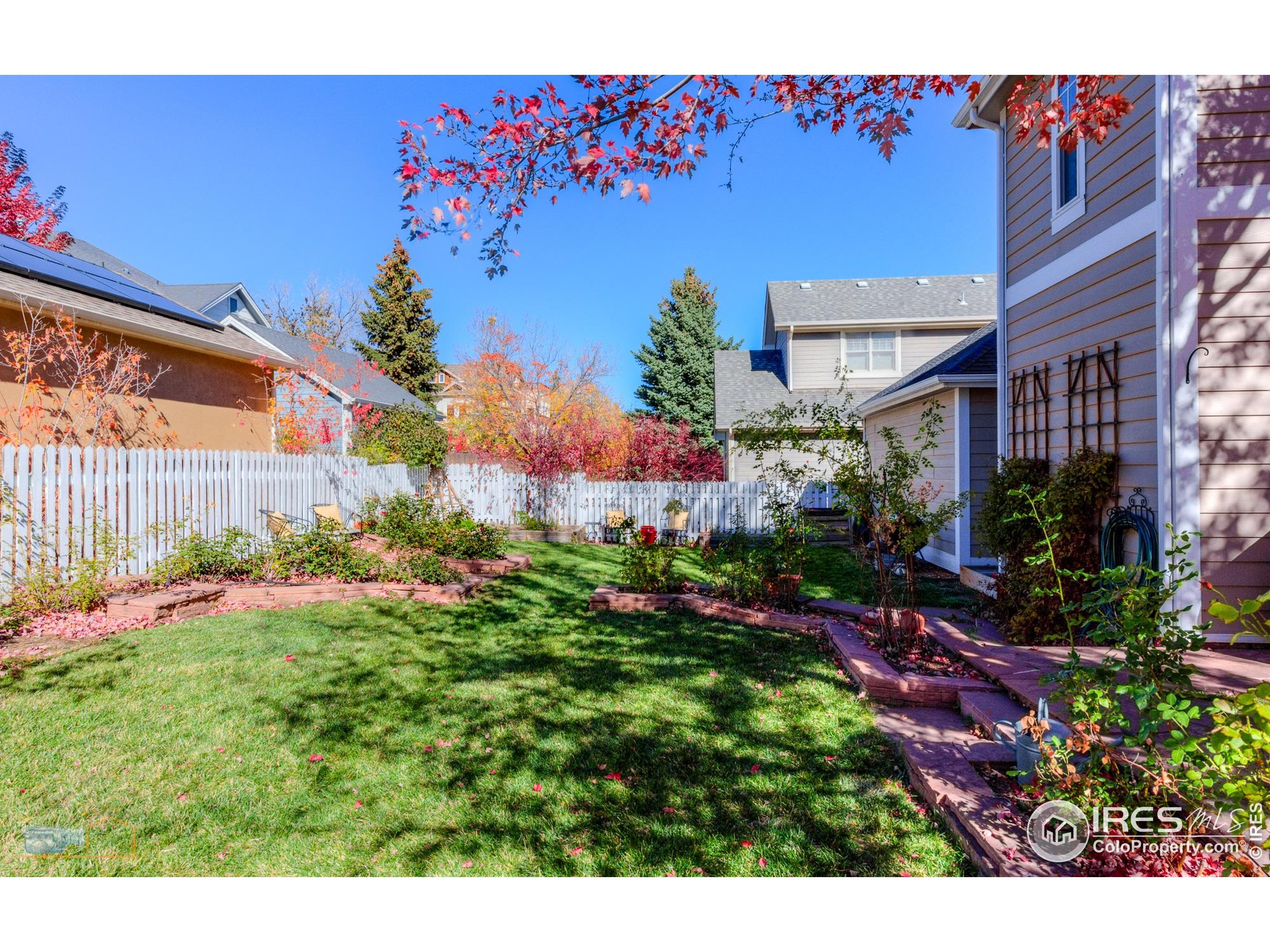 4921 Fountain Street Boulder, CO 80304 - Photo 12 of 50 a view of a house with a backyard and garden