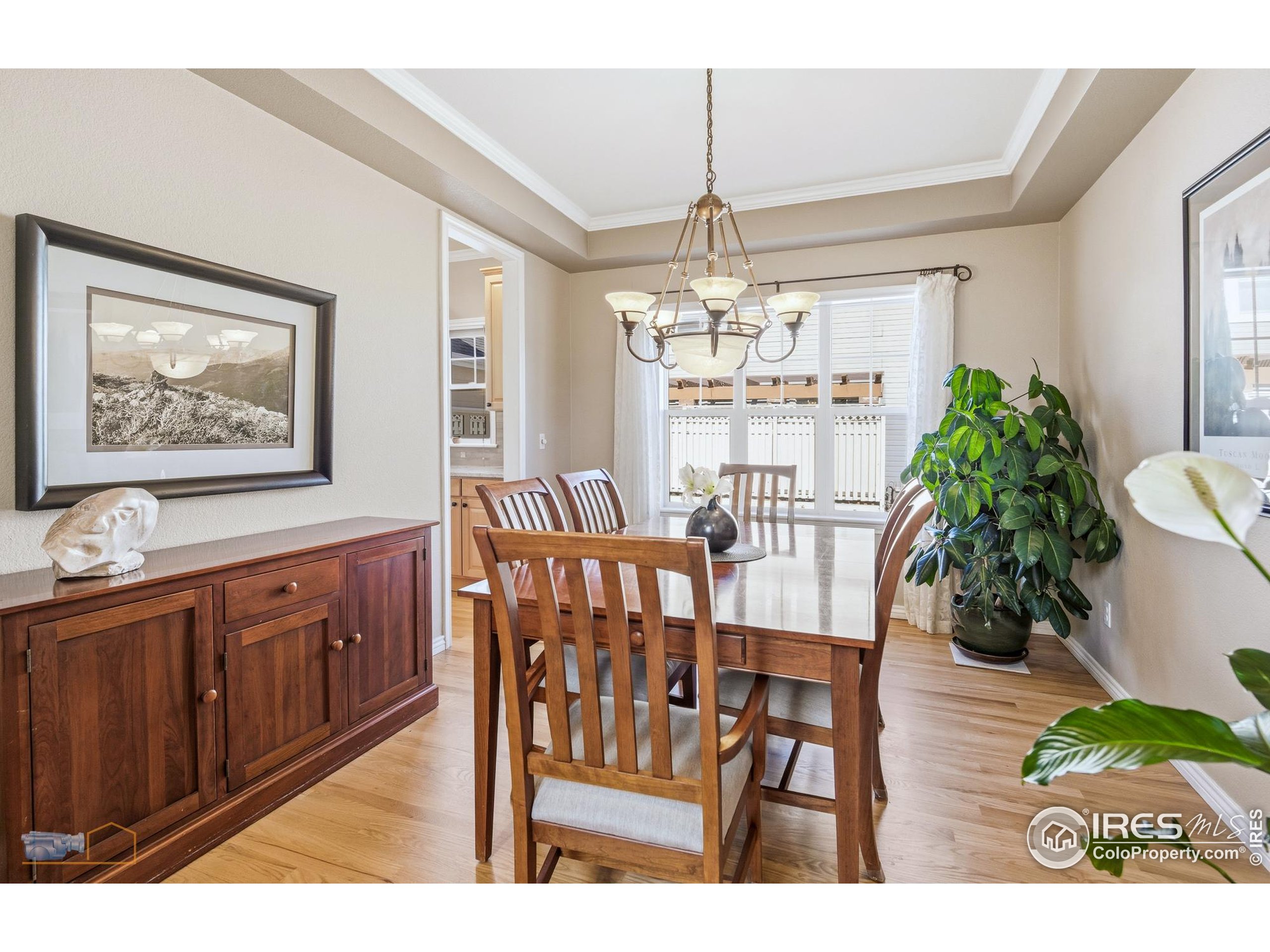 4921 Fountain Street Boulder, CO 80304 - Photo 14 of 50 a view of a dining room with furniture wooden floor and chandelier