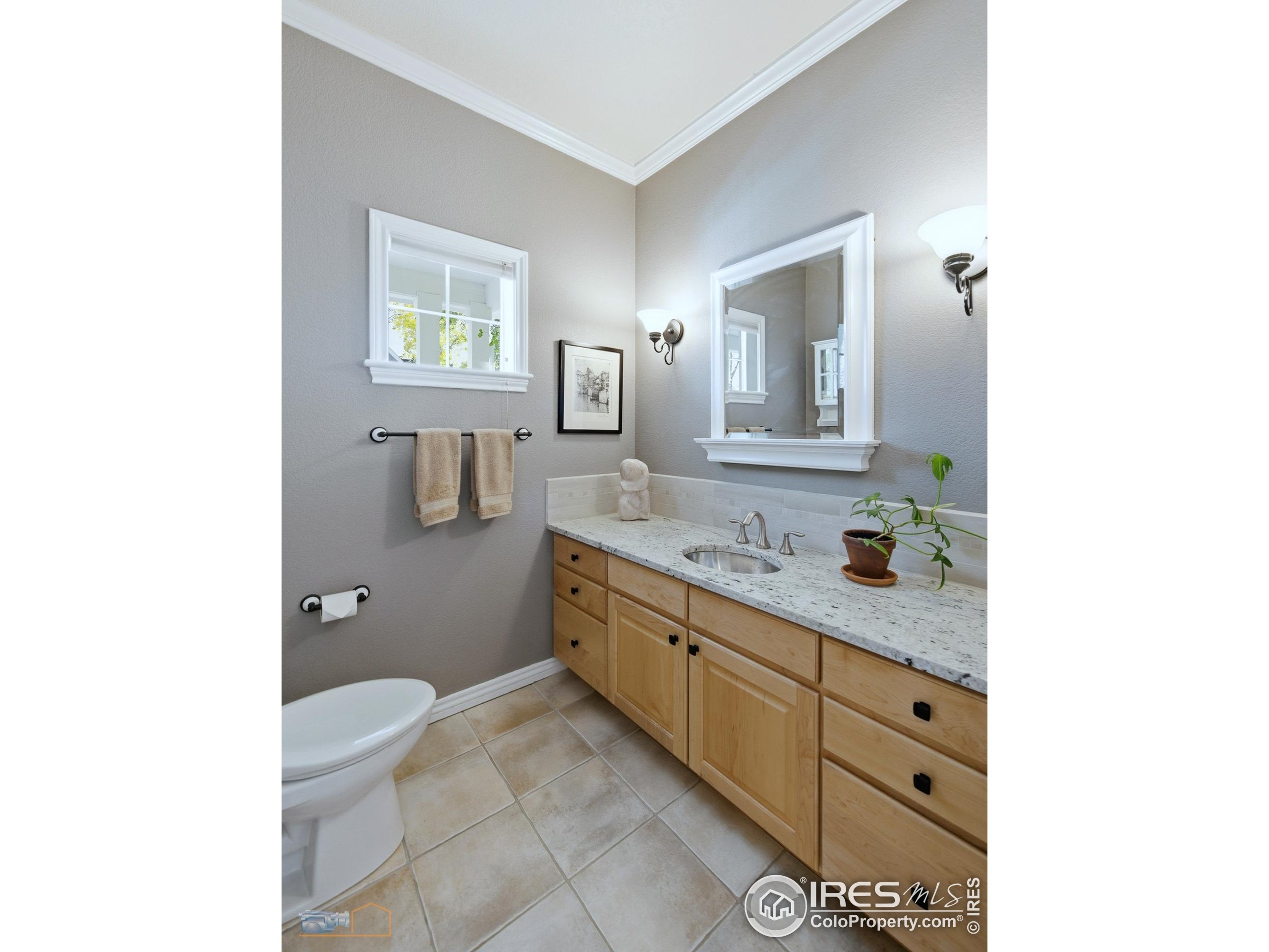 4921 Fountain Street Boulder, CO 80304 - Photo 16 of 50 a spacious bathroom with a granite countertop sink mirror and toilet