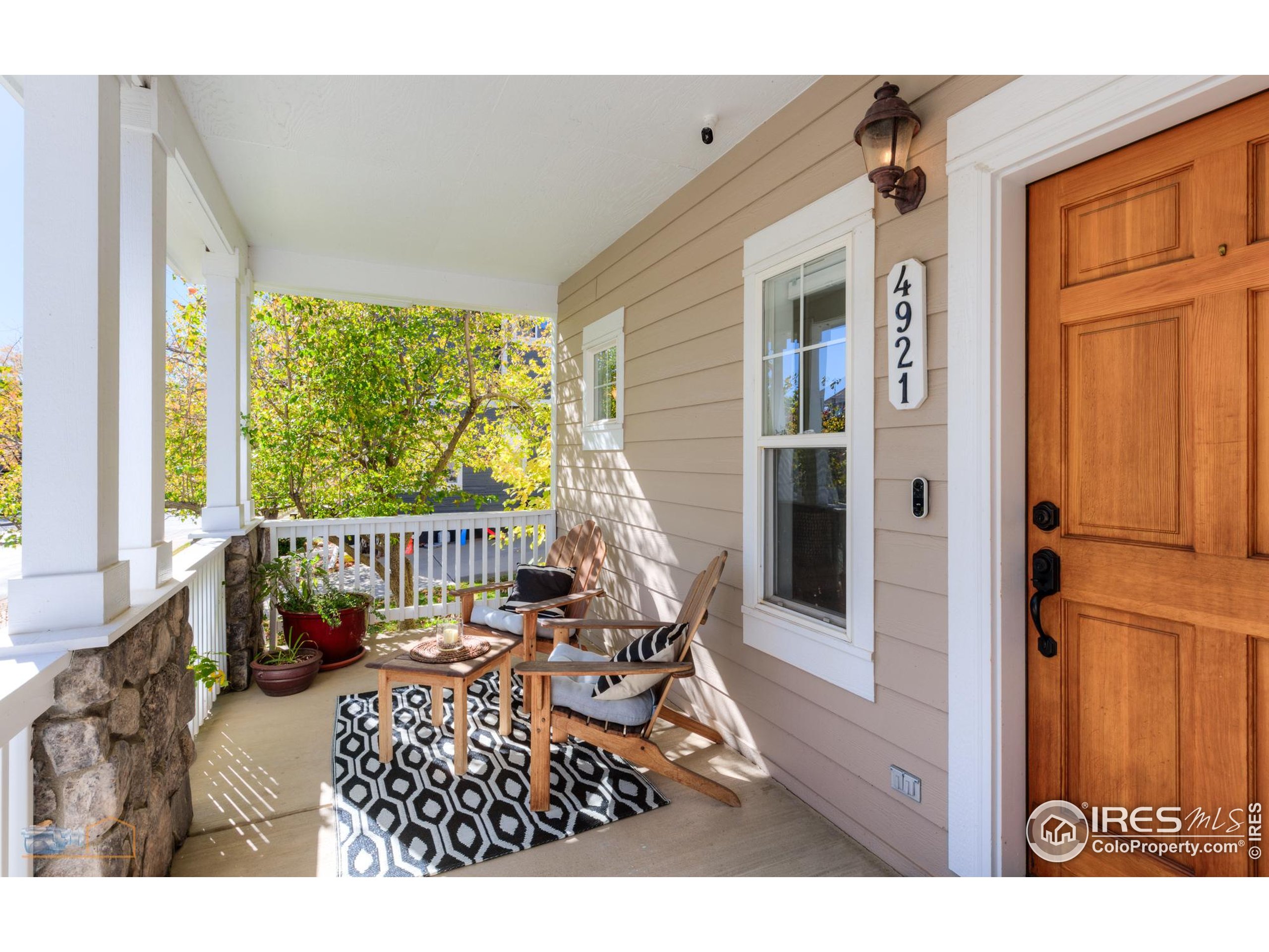 4921 Fountain Street Boulder, CO 80304 - Photo 2 of 50 a balcony view with a dining table and a chairs with wooden floor