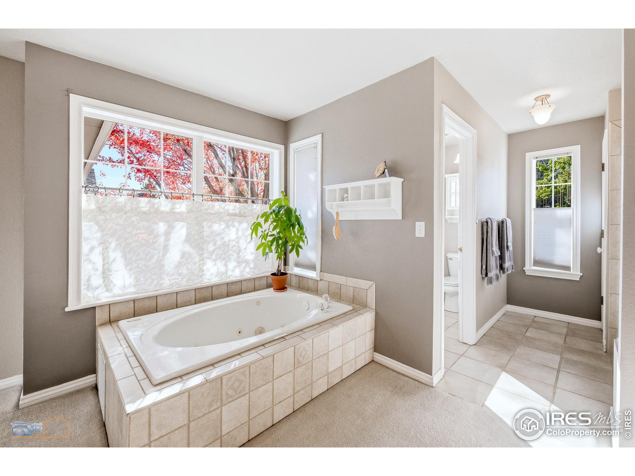 4921 Fountain Street Boulder, CO 80304 - Photo 25 of 50 a bathroom with a tub and shower