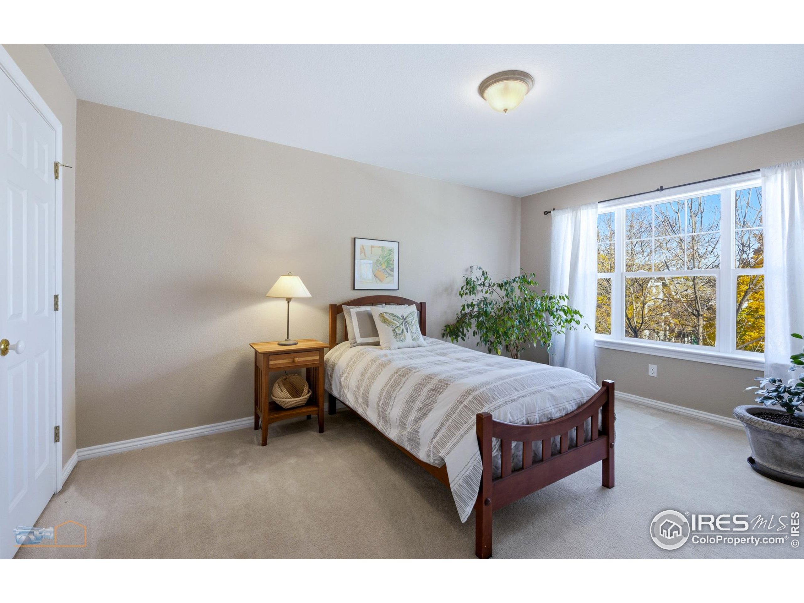 4921 Fountain Street Boulder, CO 80304 - Photo 29 of 50 a bedroom with a bed and window