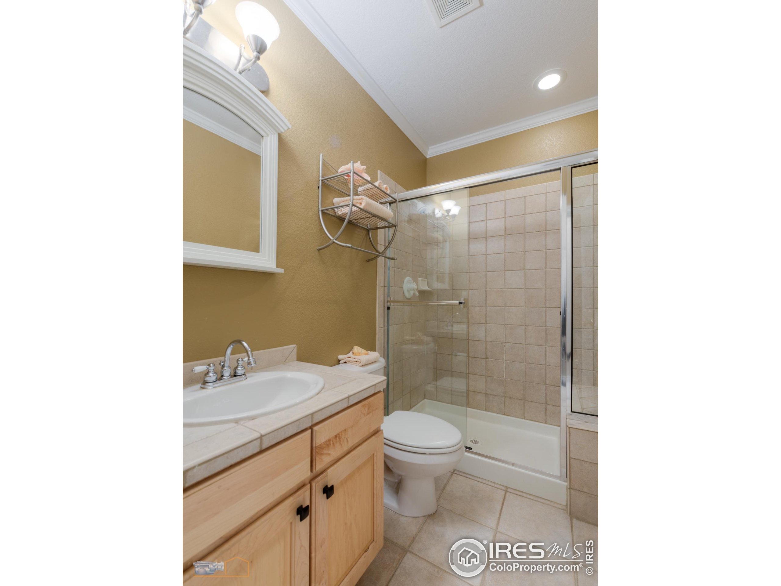 4921 Fountain Street Boulder, CO 80304 - Photo 36 of 50 a bathroom with a sink a toilet and shower