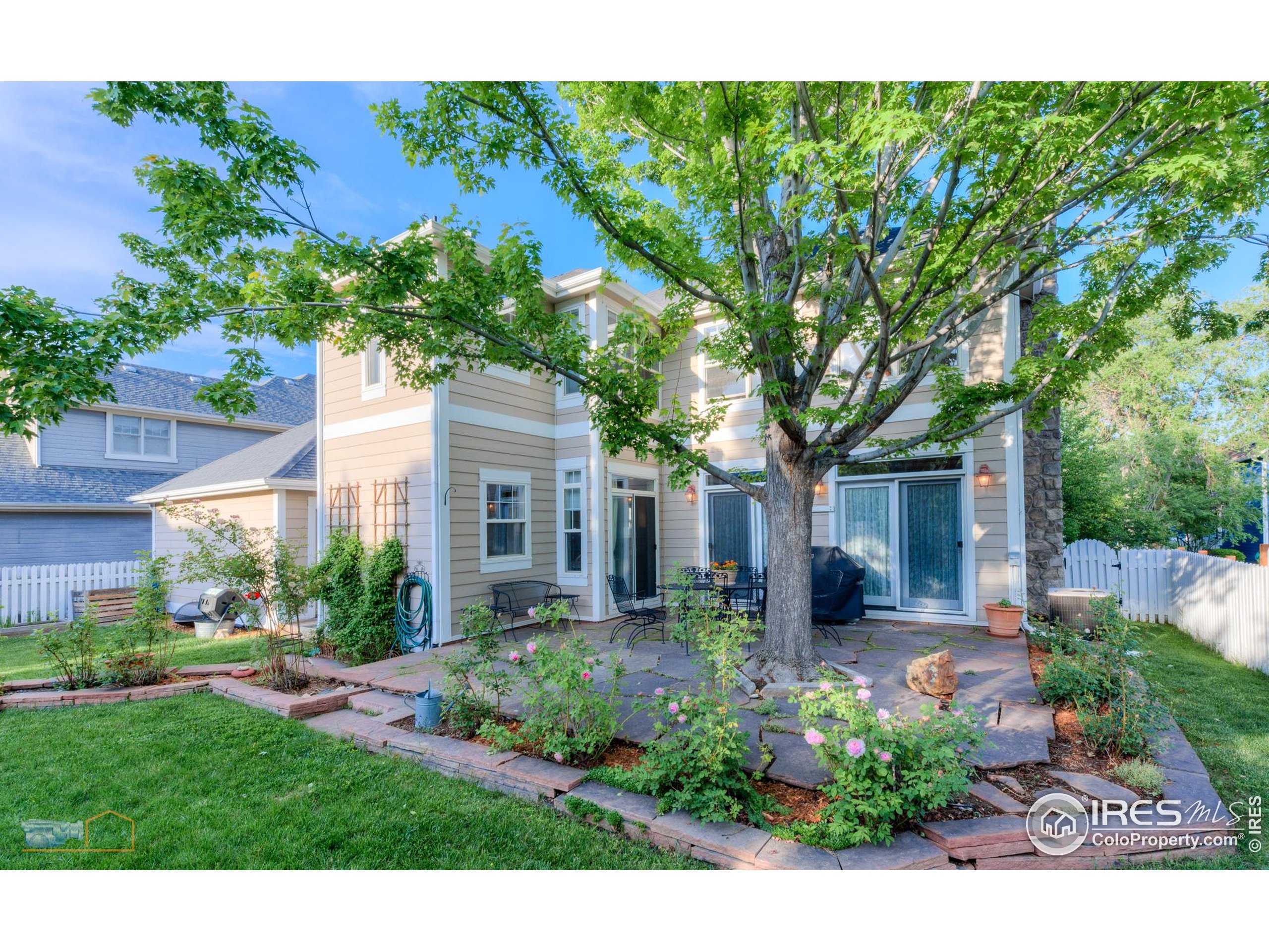 4921 Fountain Street Boulder, CO 80304 - Photo 40 of 50 a front view of a house with a yard and potted plants