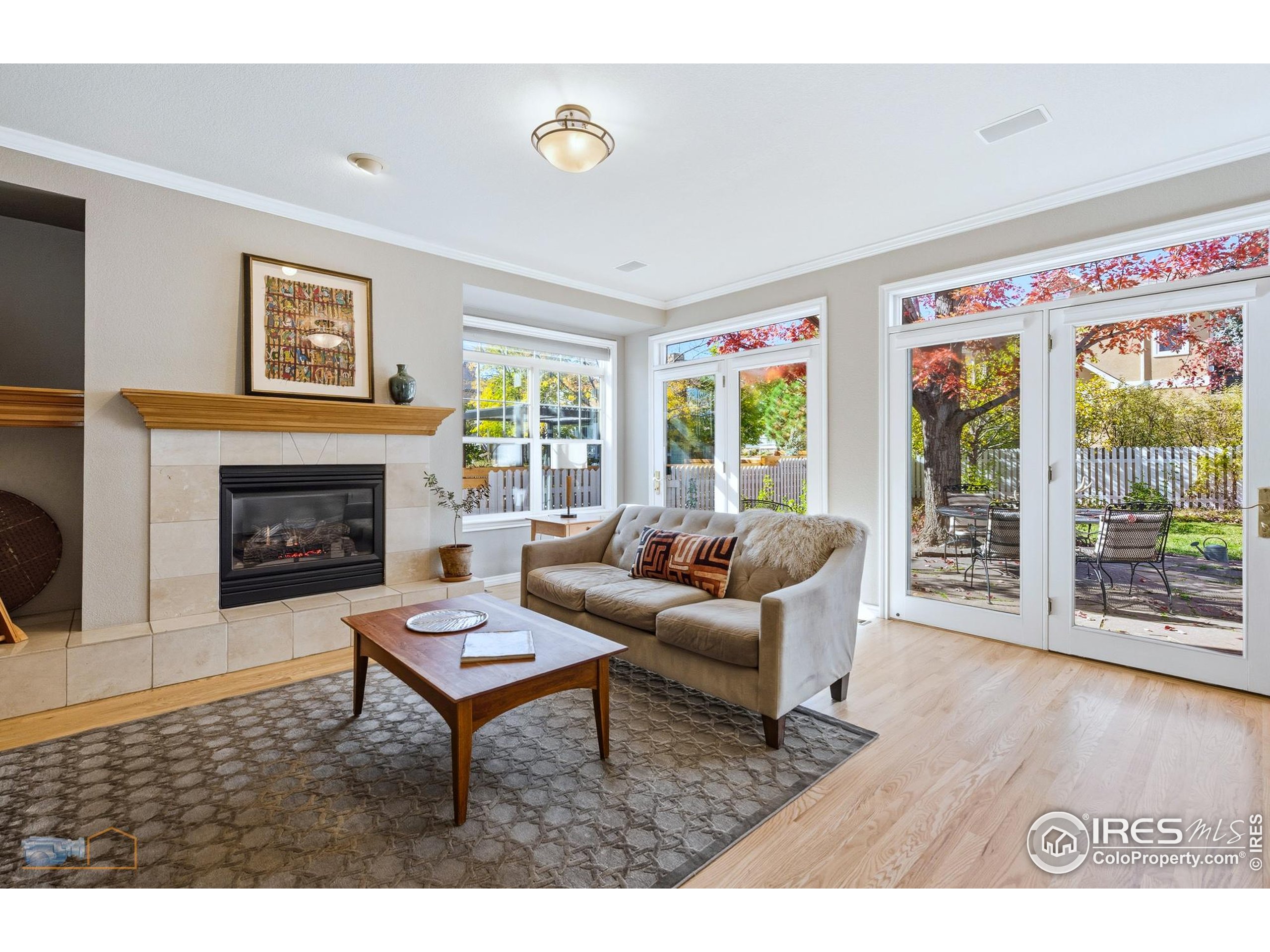 4921 Fountain Street Boulder, CO 80304 - Photo 4 of 50 a living room with furniture a large window and a fireplace