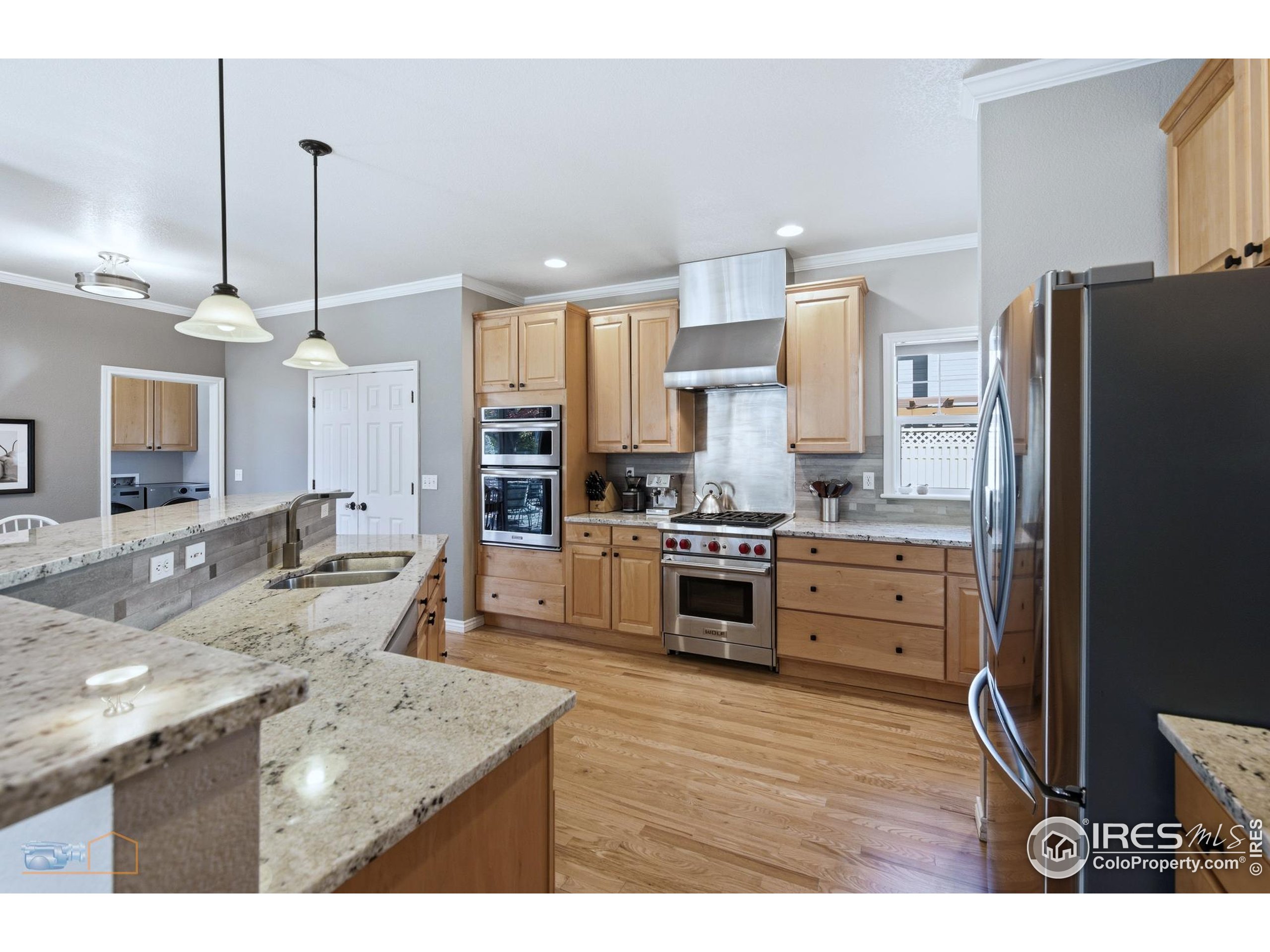 4921 Fountain Street Boulder, CO 80304 - Photo 5 of 50 a kitchen with stainless steel appliances kitchen island granite countertop a refrigerator a sink a stove and oven