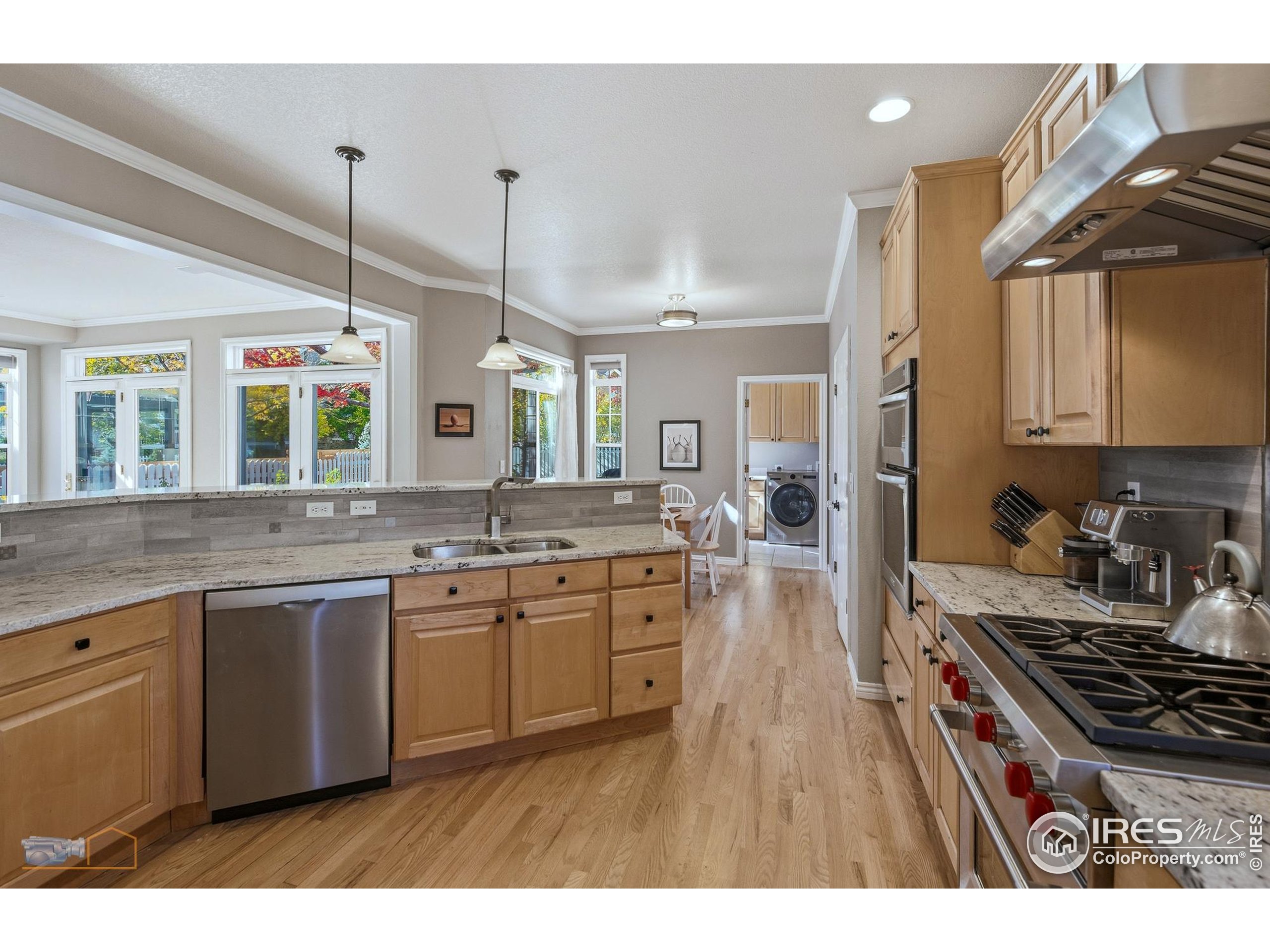 4921 Fountain Street Boulder, CO 80304 - Photo 6 of 50 a kitchen with stainless steel appliances granite countertop a stove and cabinets