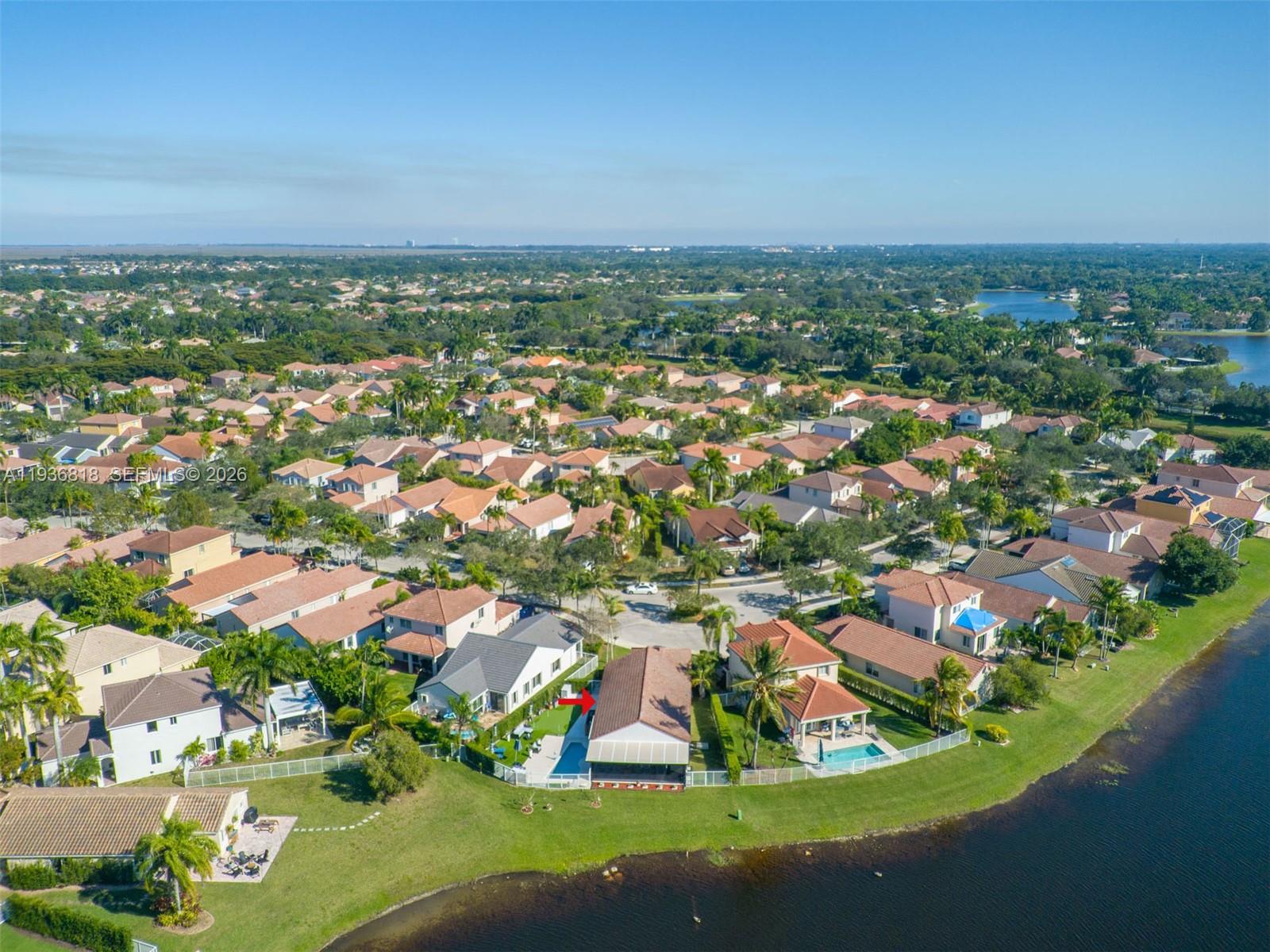 1409 Majesty Terrace Weston, FL 33327 - Photo 12 of 61 an aerial view of residential houses with outdoor space and trees