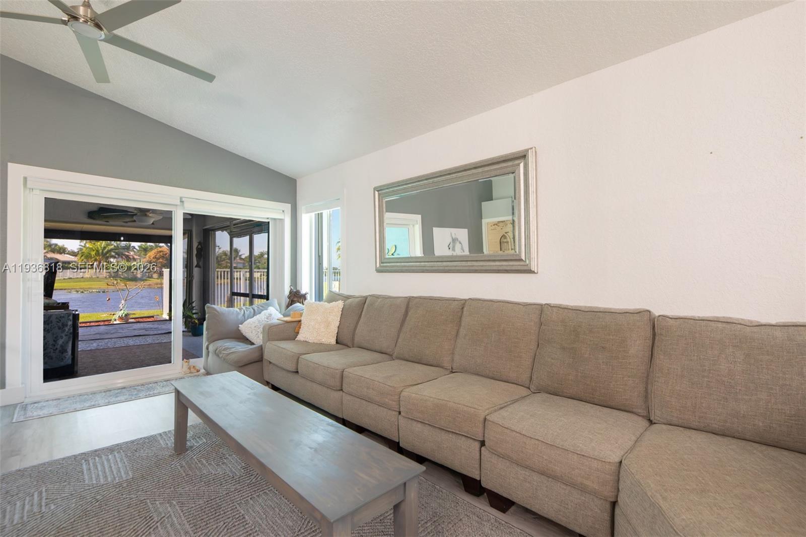 1409 Majesty Terrace Weston, FL 33327 - Photo 17 of 61 a living room with furniture and a large window