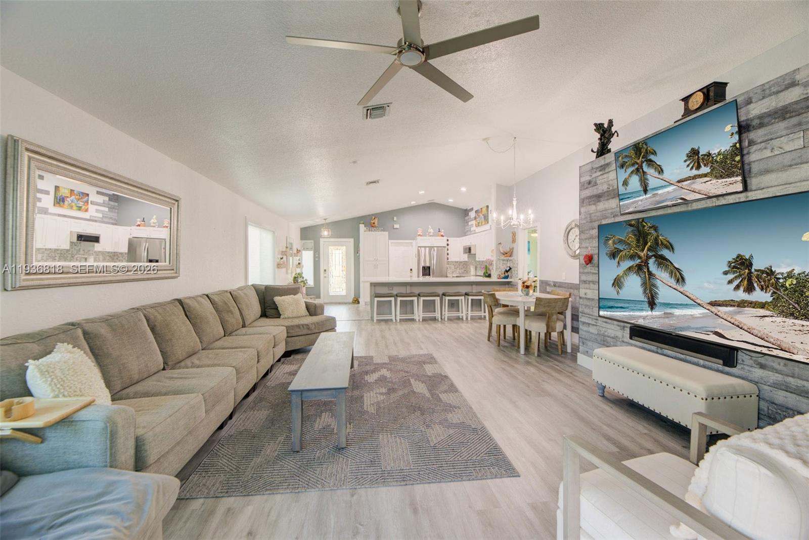1409 Majesty Terrace Weston, FL 33327 - Photo 19 of 61 a living room with furniture and a wooden floor