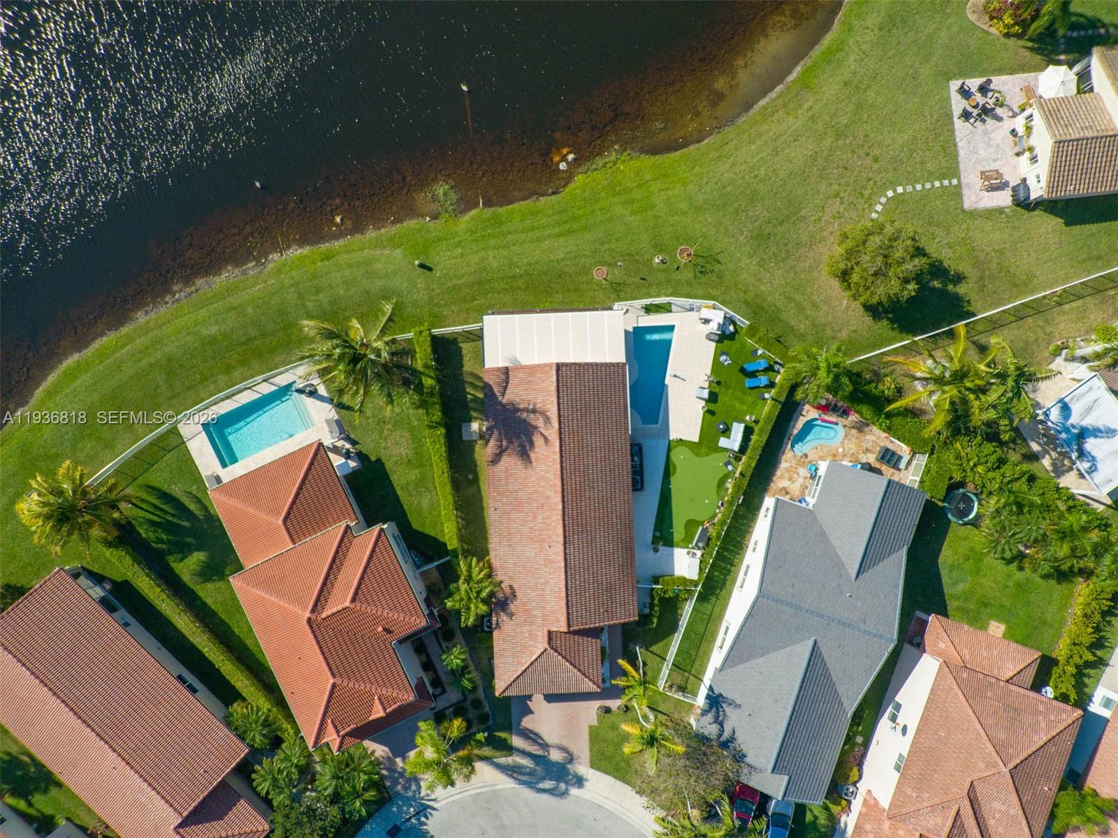 1409 Majesty Terrace Weston, FL 33327 - Photo 2 of 61 an aerial view of a house with a yard basket ball court and outdoor seating