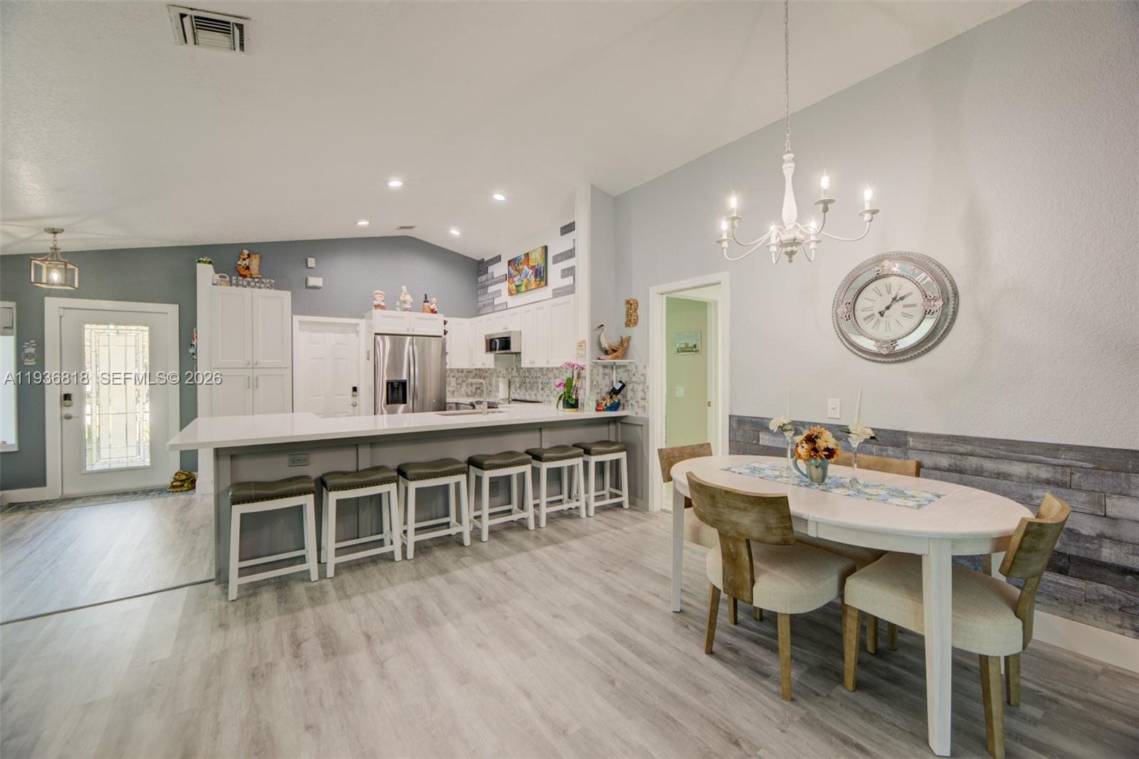 1409 Majesty Terrace Weston, FL 33327 - Photo 21 of 61 a view of a dining room with furniture and wooden floor