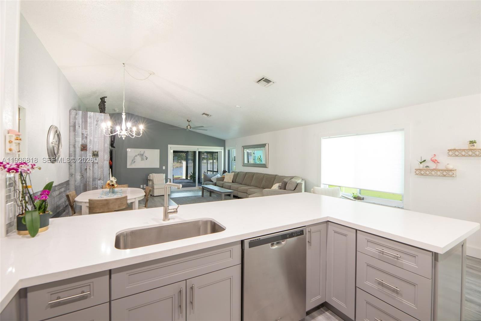 1409 Majesty Terrace Weston, FL 33327 - Photo 26 of 61 a kitchen with a sink and cabinets