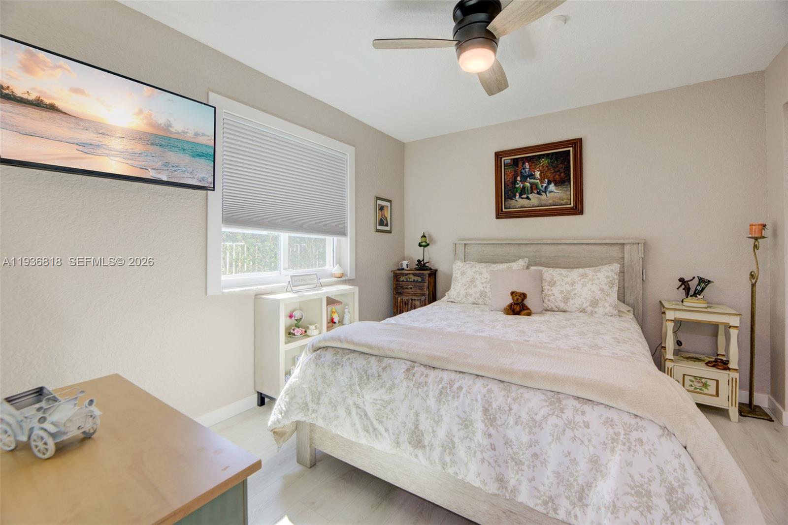 1409 Majesty Terrace Weston, FL 33327 - Photo 33 of 61 a bedroom with a bed and a table