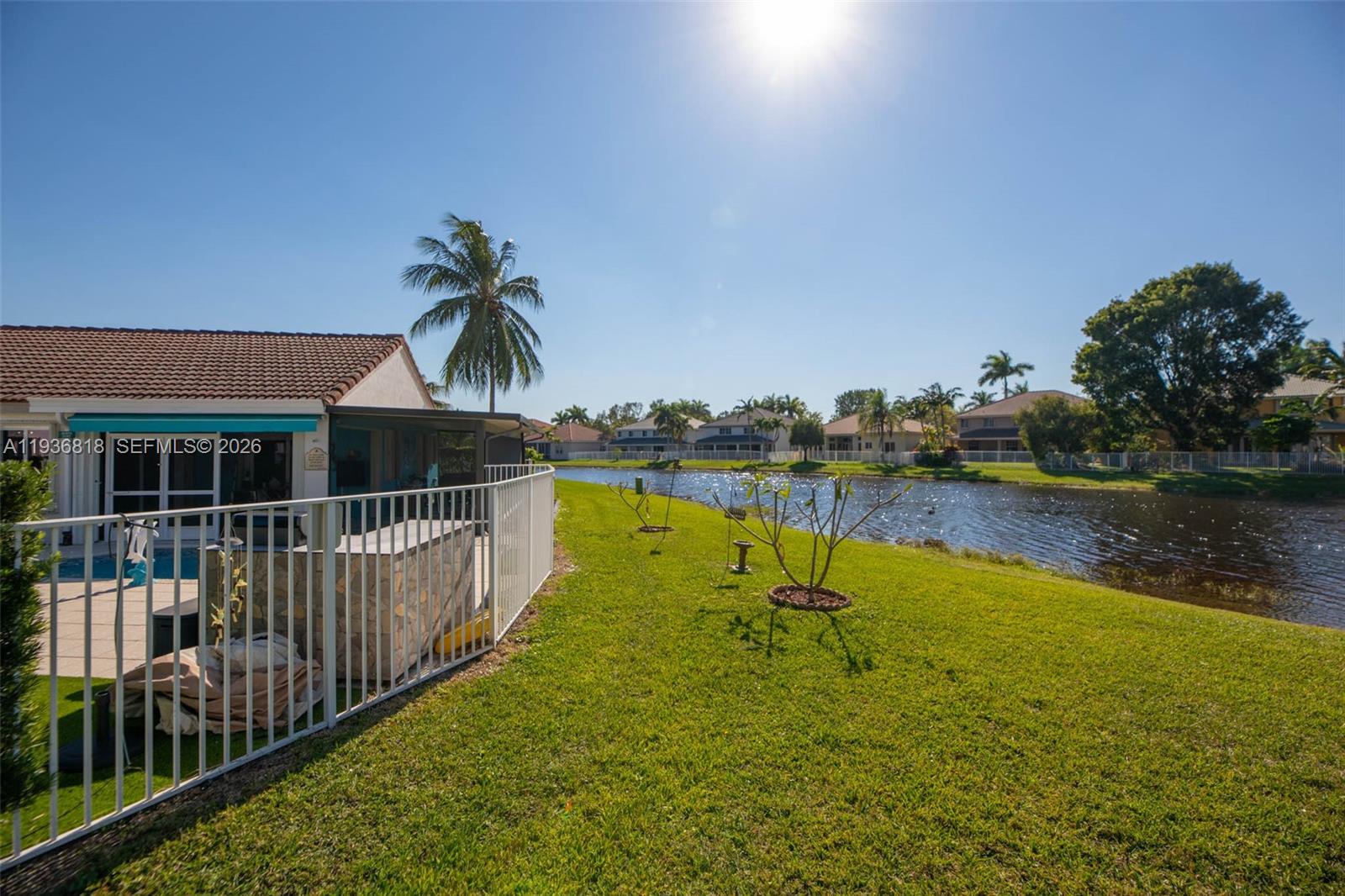 1409 Majesty Terrace Weston, FL 33327 - Photo 48 of 61 a view of a house with pool and a yard