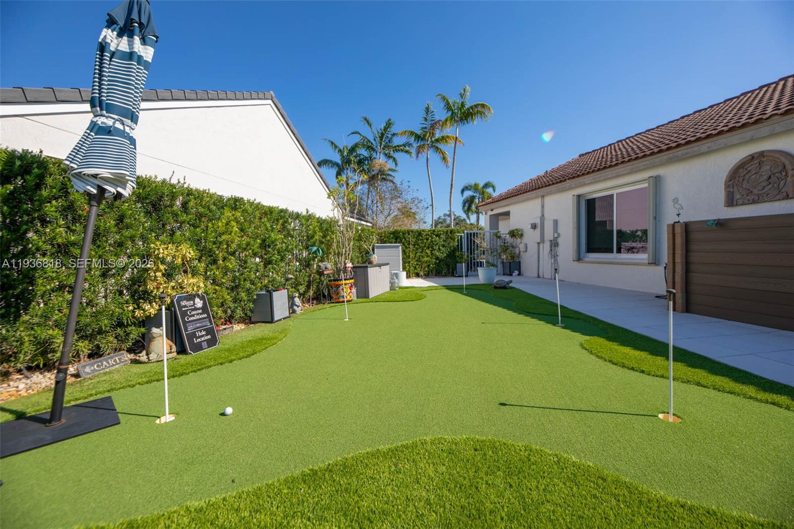 1409 Majesty Terrace Weston, FL 33327 - Photo 54 of 61 a view of an house with backyard space and garden