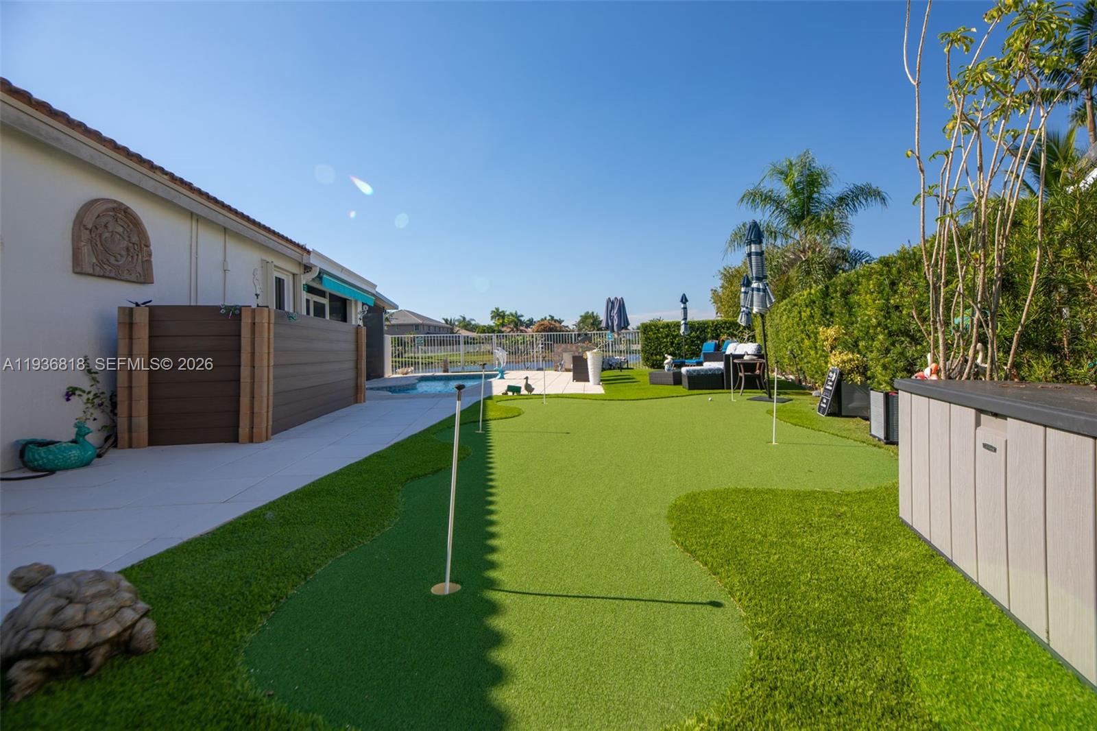1409 Majesty Terrace Weston, FL 33327 - Photo 55 of 61 a view of a backyard with a garden