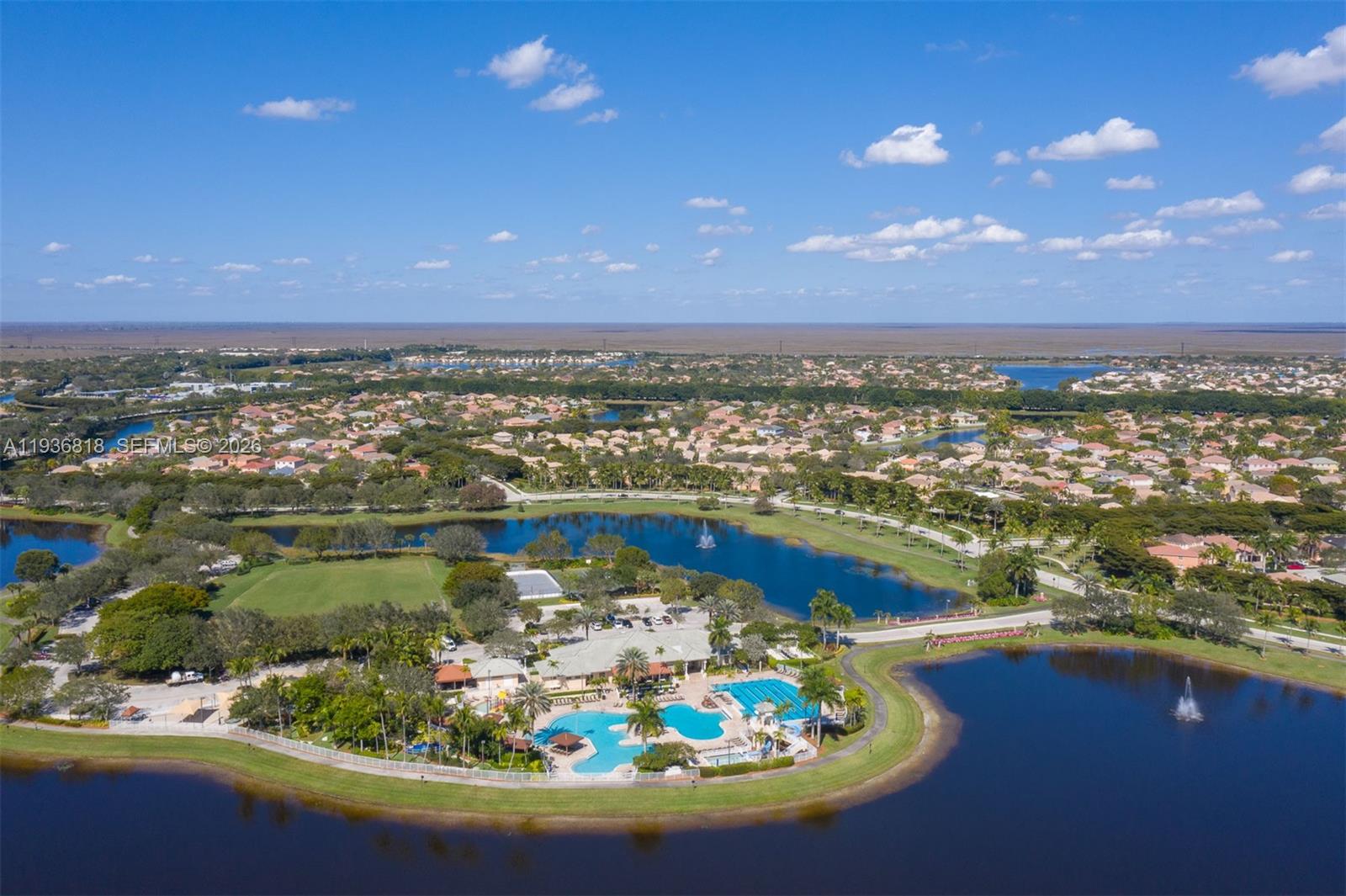1409 Majesty Terrace Weston, FL 33327 - Photo 59 of 61 an aerial view of a house with a lake view