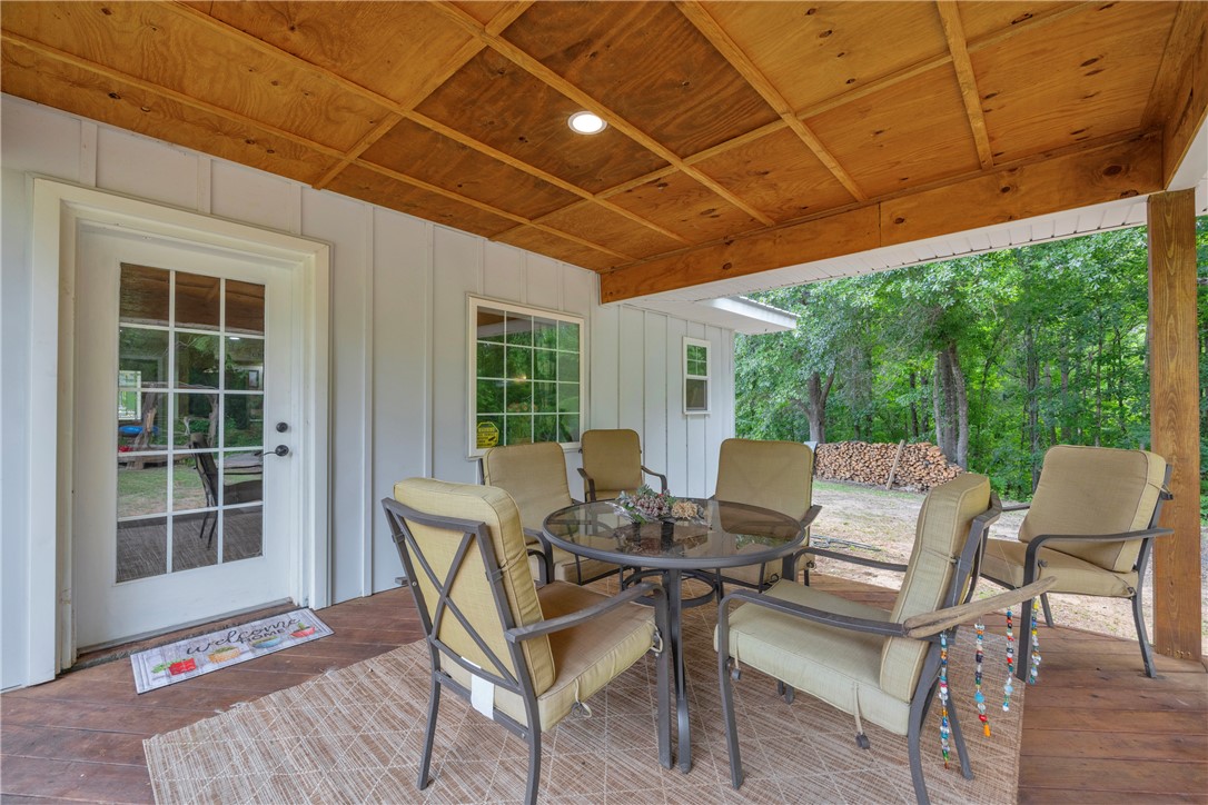 3030 Smith McGee Road Iva, SC 29655 - Photo 25 of 46 An inviting covered patio features ample space for outdoor dining and relaxation.