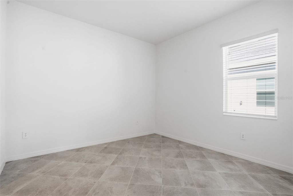 13092 Tulum Loop Venice, FL 34293 - Photo 8 of 24 an empty room with a window