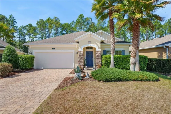a kitchen with kitchen island granite countertop lots of counter top space and stainless steel appliances