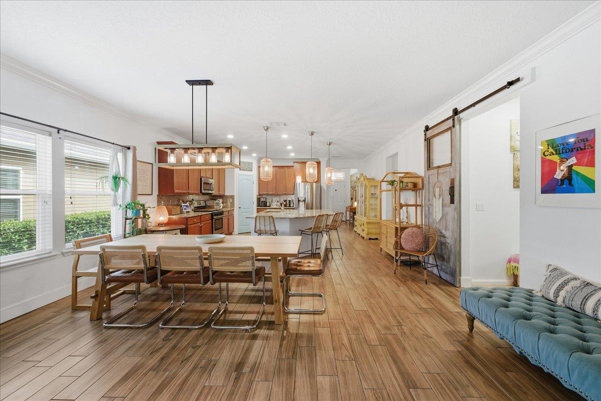 110 Ceja Way St. Augustine, FL 32095 - Photo 11 of 78 a living room with lots of furniture and wooden floor