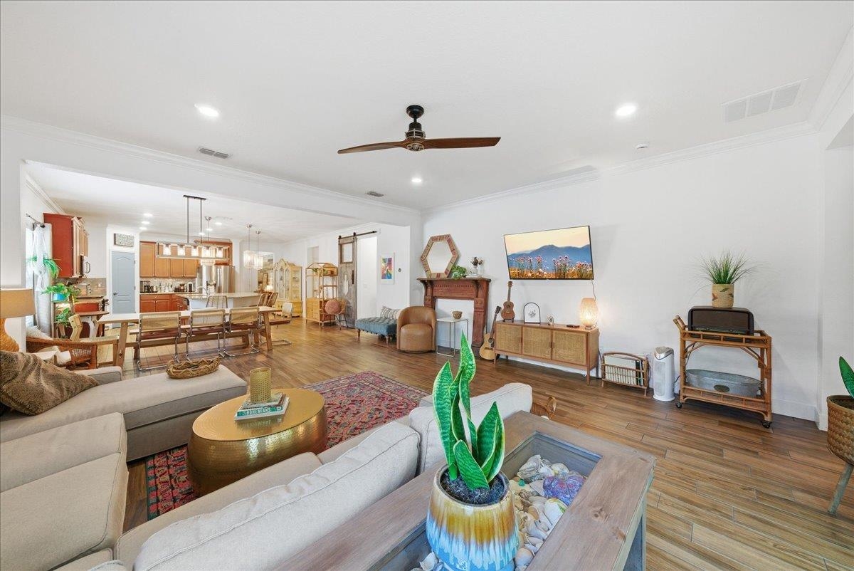 110 Ceja Way St. Augustine, FL 32095 - Photo 13 of 78 a living room with fireplace furniture and a wooden floor