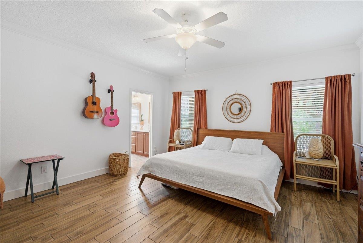 110 Ceja Way St. Augustine, FL 32095 - Photo 14 of 78 a bedroom with a bed and a chandelier