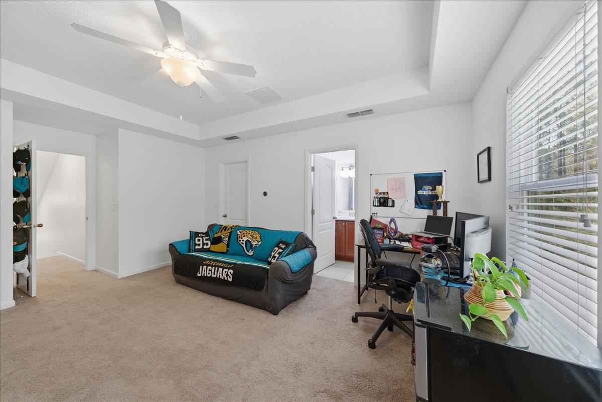 110 Ceja Way St. Augustine, FL 32095 - Photo 29 of 78 a living room with furniture gym equipment and a window