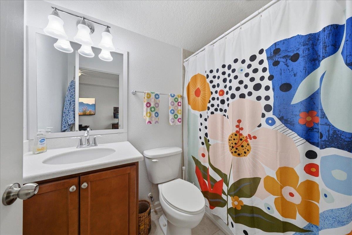 110 Ceja Way St. Augustine, FL 32095 - Photo 30 of 78 a bathroom with a sink mirror vanity and toilet
