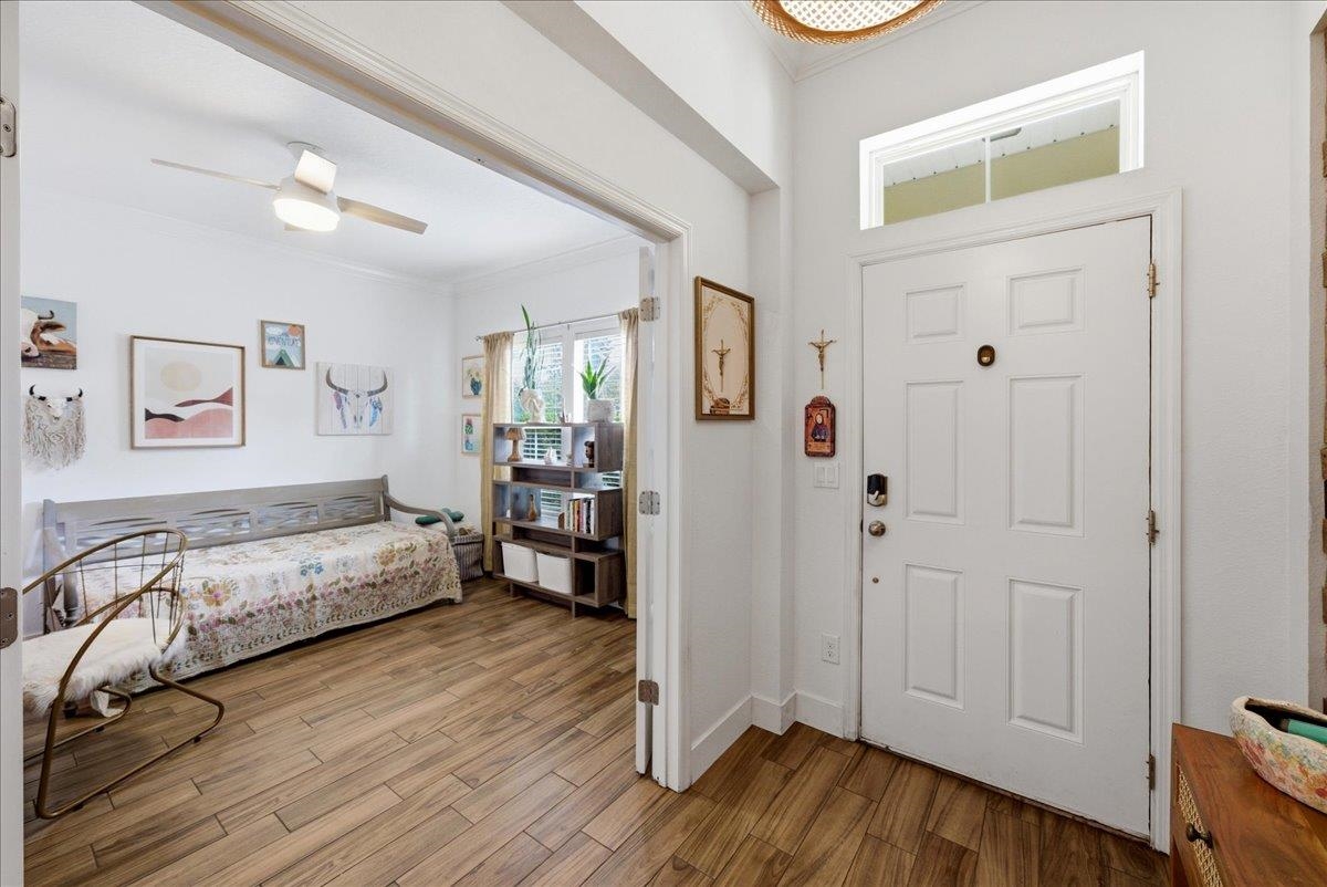 110 Ceja Way St. Augustine, FL 32095 - Photo 31 of 78 a spacious bedroom with a bed and a wooden floor