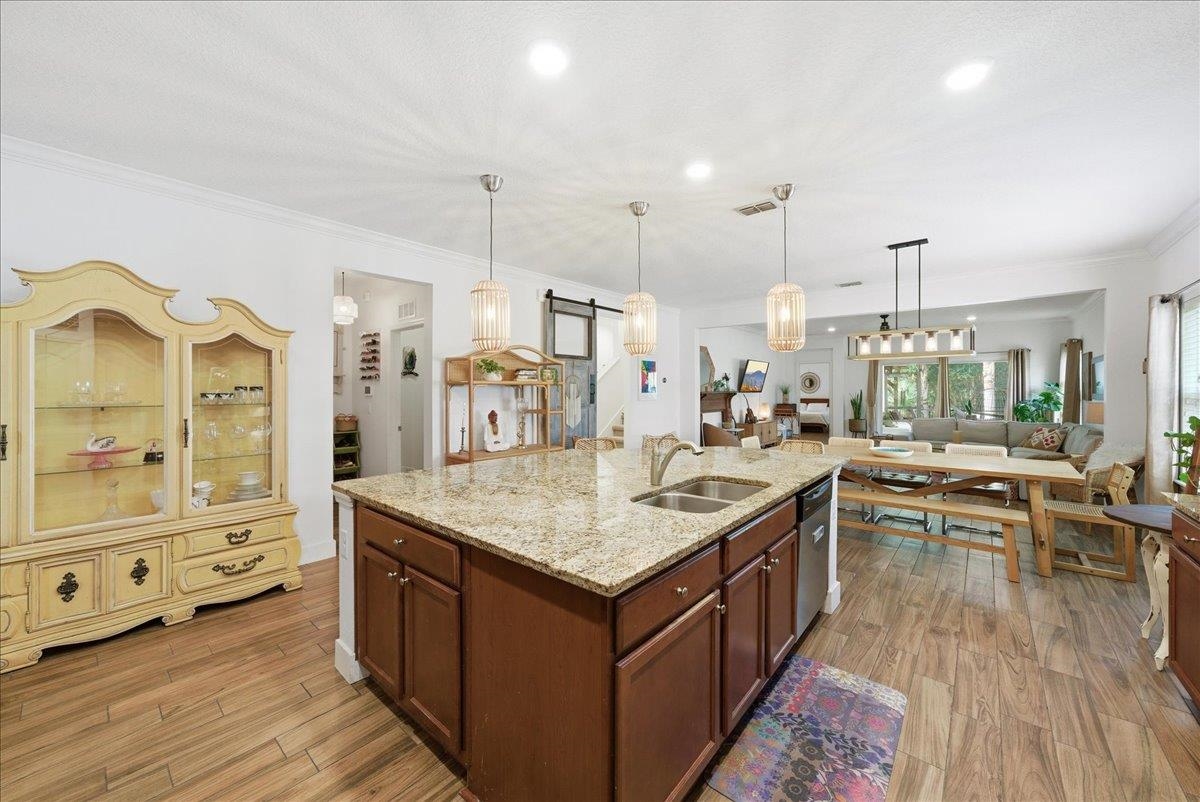 110 Ceja Way St. Augustine, FL 32095 - Photo 5 of 78 a kitchen with kitchen island granite countertop lots of counter top space and stainless steel appliances