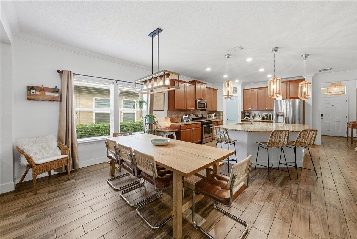 110 Ceja Way St. Augustine, FL 32095 - Photo 9 of 78 a view of a dining room with furniture window and wooden floor