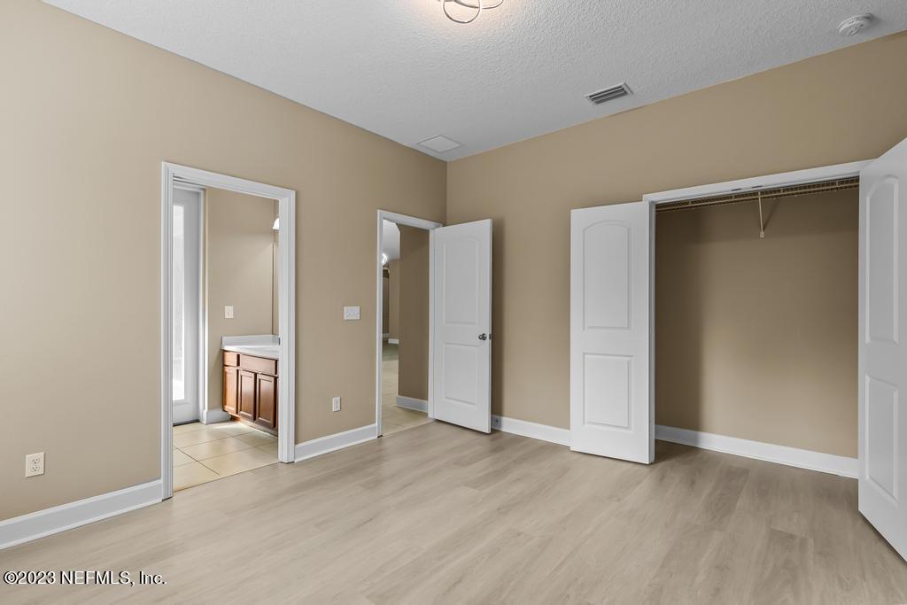 126 Arabian Court St. Augustine, FL 32095 - Photo 20 of 62 a view of an empty room with wooden floor and closet